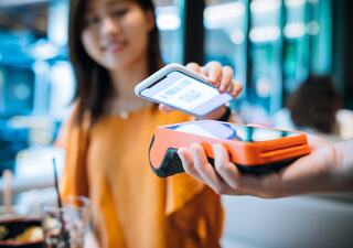 Customer using mobile point of sale payment technology